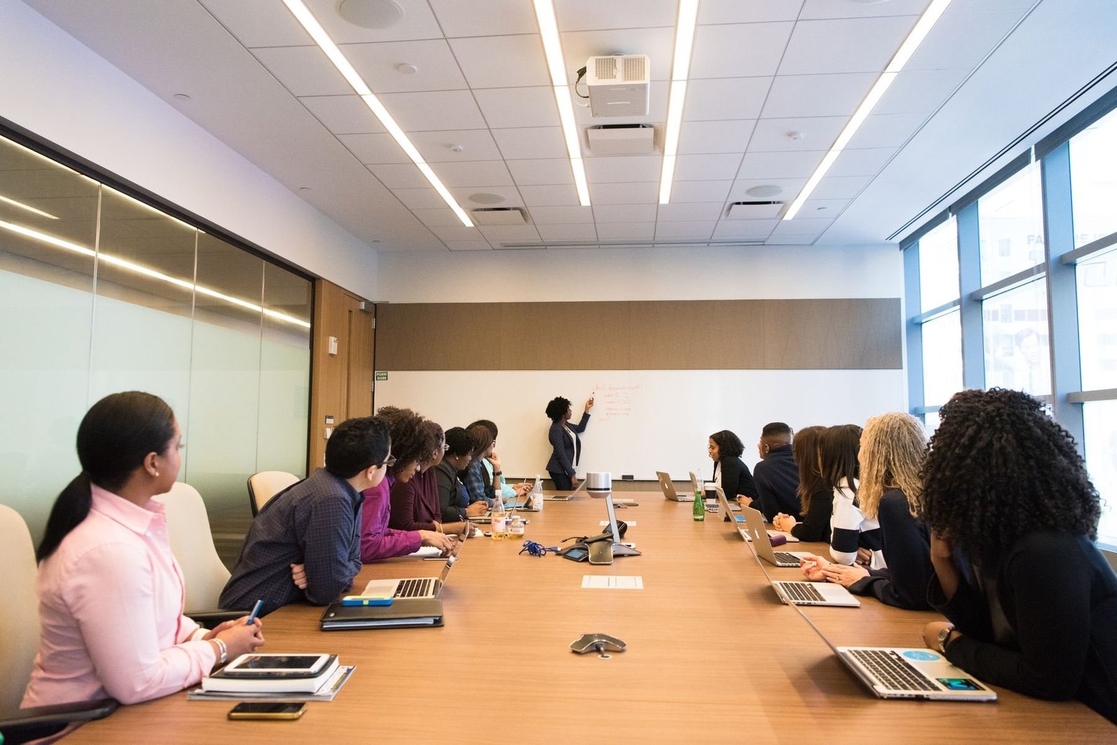 A consultant leading a strategy session in a boardroom